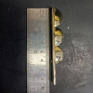 Long goldtone brooch